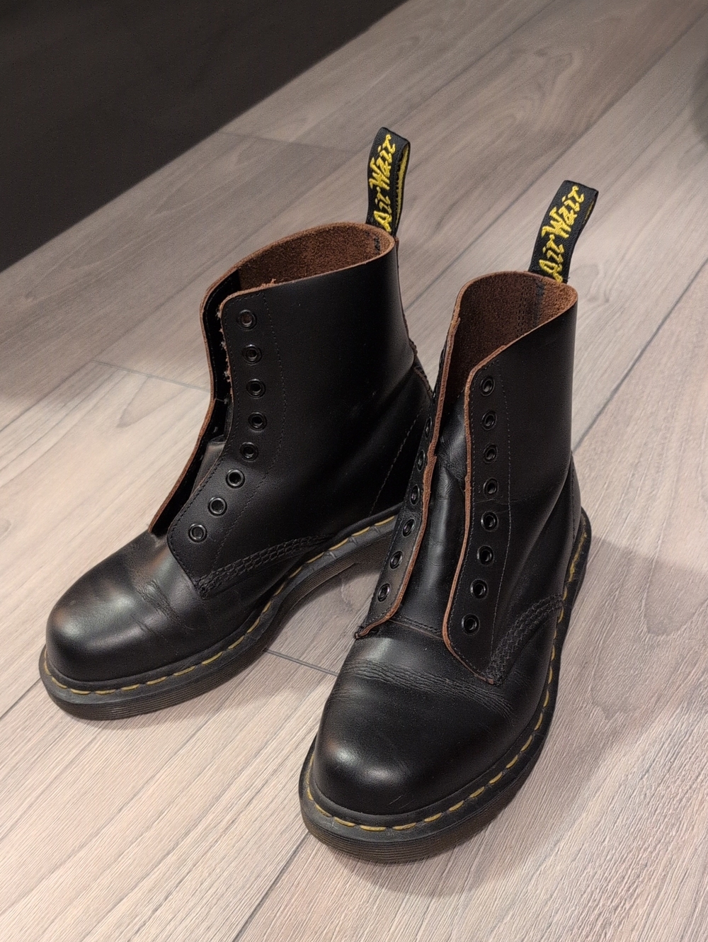 Dr. Martens Black Leather 8-Eye Boots with Yellow Pull Tabs